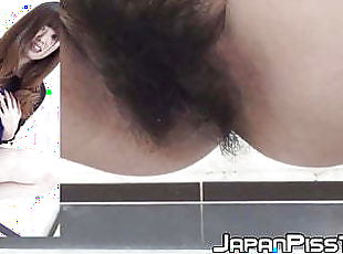 Pretty Japanese babe with hairy pussy pissing hard
